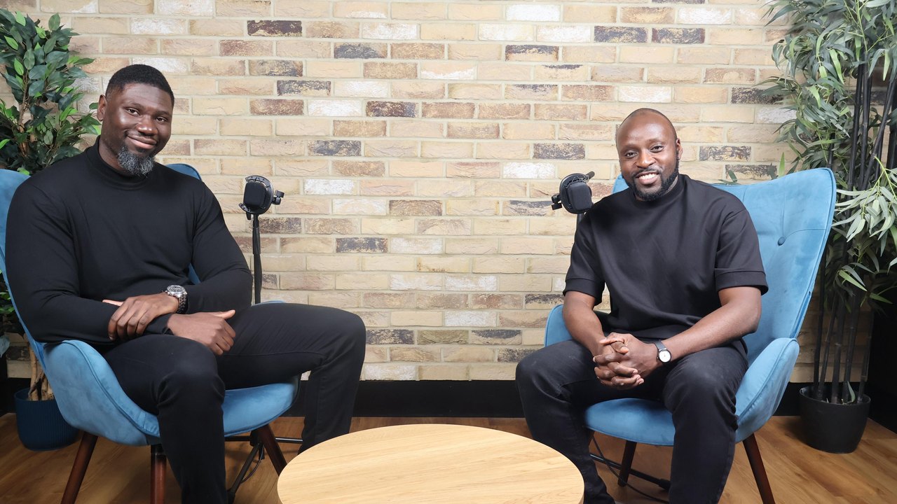 Jason Agbodza seated in conversation on a podcast set
